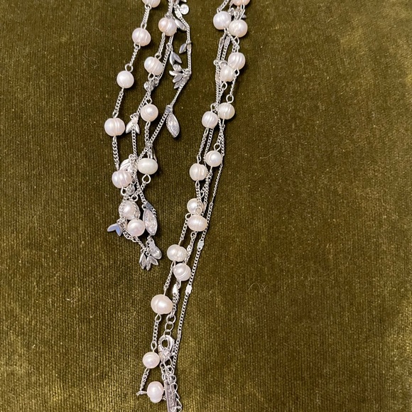 A thin 20” long 2-themed necklace. One necklace has a pearl like design and… - Picture 2 of 5